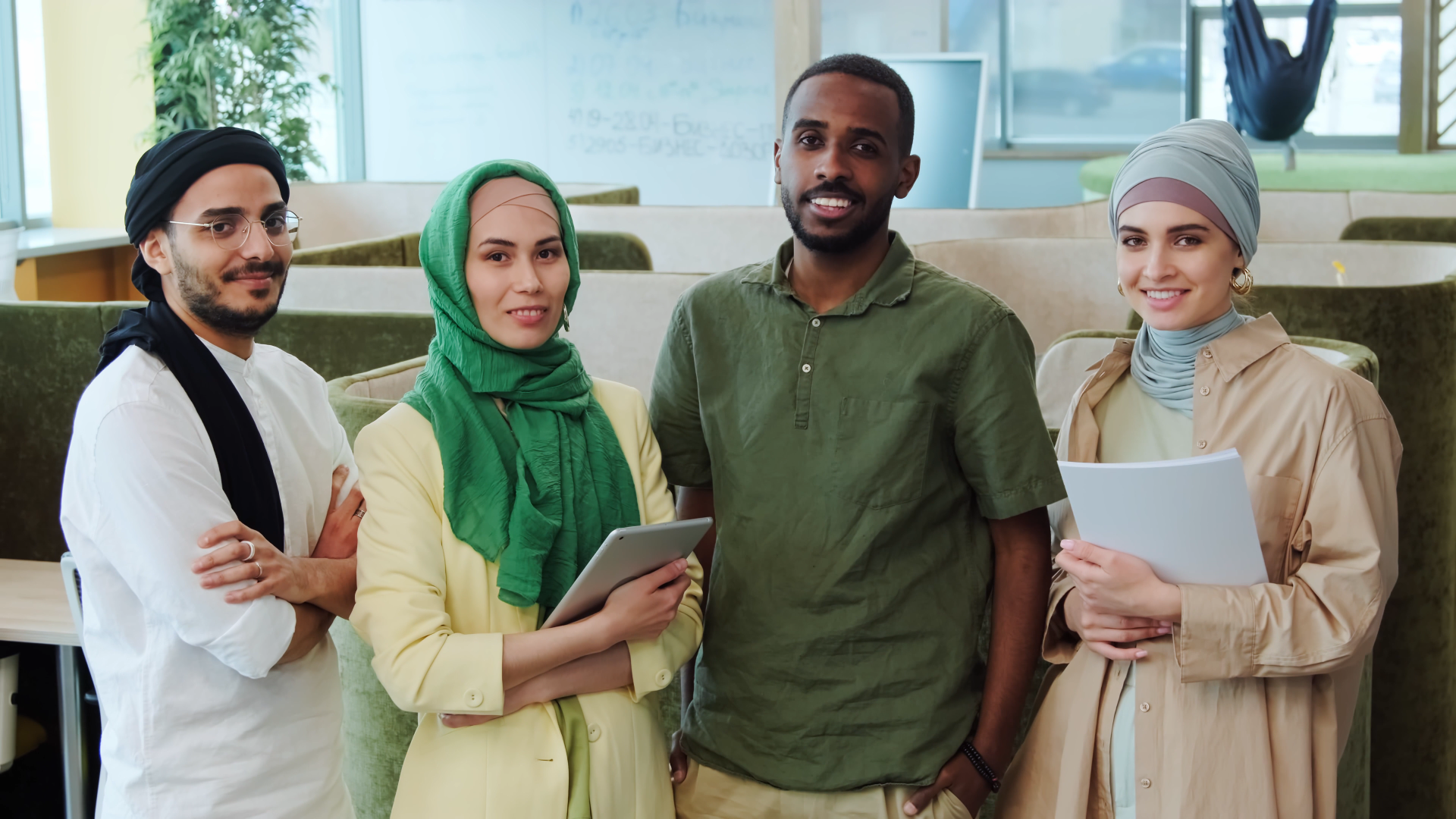 Muslim youth gathered together, laughing and building community